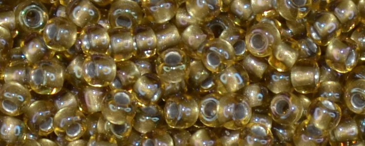 (image for) TOHO 11/o Round-Bronze Lined Topaz Rainbow. 11T279