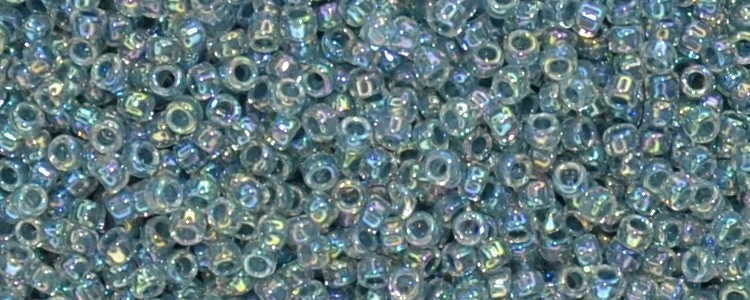 (image for) TOHO 15/o Round Seed Bead-Blue Topaz Lined Crystal Rainbow. 15T773