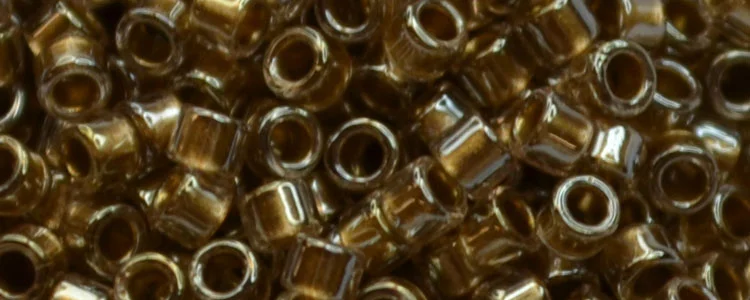 (image for) TOHO Aiko Precision Cylinder Bead. Metallic Lined Light Topaz Luster TB-1012