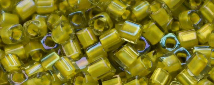 (image for) TOHO 1.5mm Cube Shape Seed Beads-Yellow Lined Light Olive Rainbow