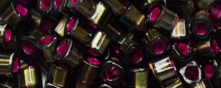 (image for) TOHO 2mm Cube Shape Seed Beads-Raspberry Lined Olivine Transparent