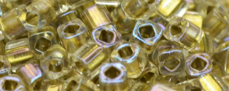 (image for) TOHO 3mm Cube Shape Seed Beads-Light Bronze Lined Crystal Rainbow
