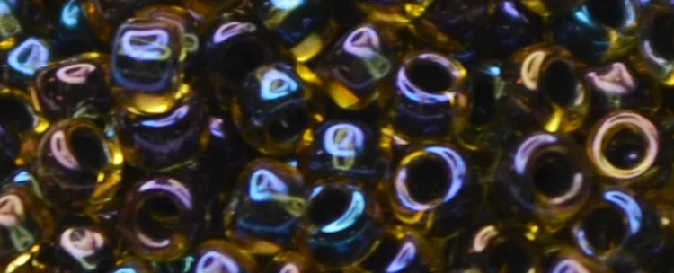 (image for) TOHO 15/o Round Seed Bead-Black Lined Topaz Rainbow. 15T245