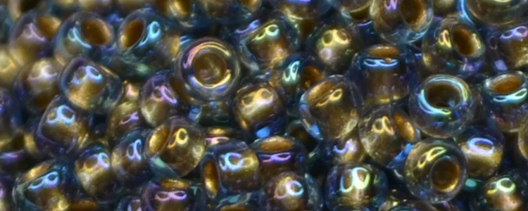 (image for) TOHO 15/o Round Seed Bead-Bronze Lined Light Sapphire Rainbow. 15T997