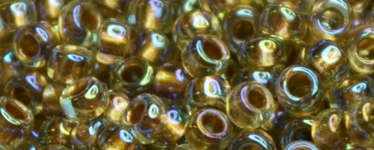 (image for) TOHO 15/o Round Seed Bead-Bronze Lined Light Topaz Rainbow. 15T998