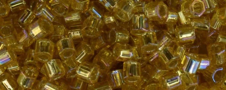 (image for) TOHO Size 8/o Hexagon Shape Seed Bead-Light Topaz Silver Lined Rainbow