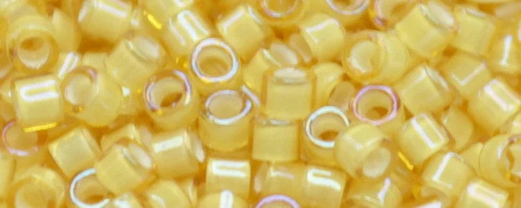 (image for) TOHO Aiko Precision Cylinder Bead. Beige Lined Light Topaz Transparent TB-948