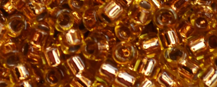 (image for) TOHO Aiko Precision Cylinder Bead. Copper Lined Topaz Transparent TB-744