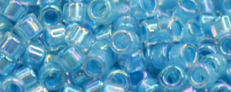 (image for) TOHO Aiko Precision Cylinder Bead. Dark Aqua Lined Crystal Rainbow TB-781