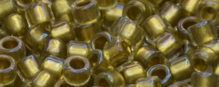 (image for) TOHO Aiko Precision Cylinder Bead. Light Bronze Lined Crystal Rainbow TB-262