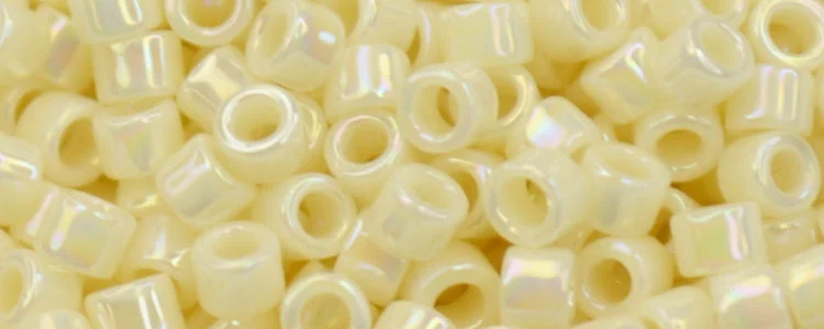 (image for) TOHO Aiko Precision Cylinder Bead. Light Cream Opaque Rainbow TB-409