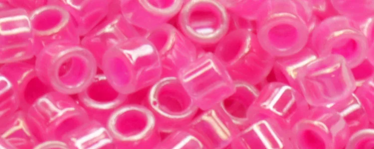 (image for) TOHO Aiko Precision Cylinder Bead. Neon Fuchsia Lined Crystal Transparent TB-837