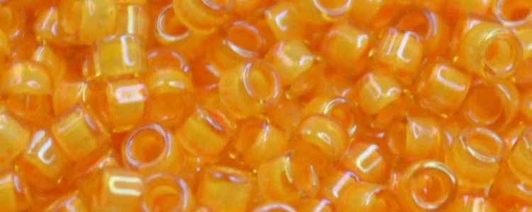 (image for) TOHO Aiko Precision Cylinder Bead. Squash Lined Topaz Transparent TB-950