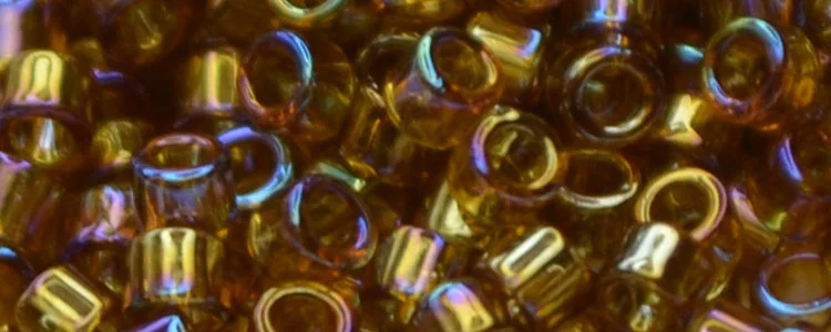 (image for) TOHO Aiko Precision Cylinder Bead. Dark Topaz Transparent Rainbow TB-162C