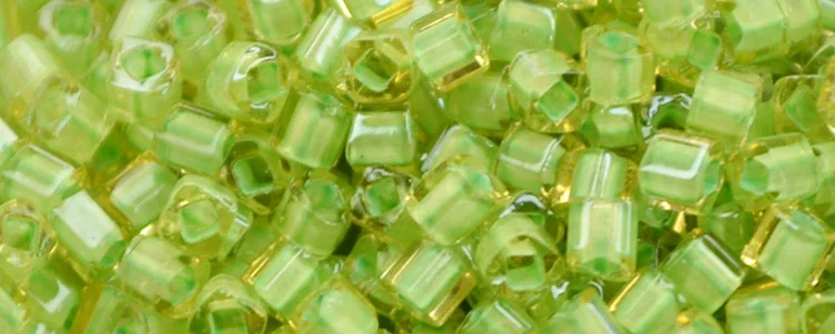 (image for) TOHO 1.5mm Cube Shape Seed Beads-Light Green Lined Light Topaz Transparent