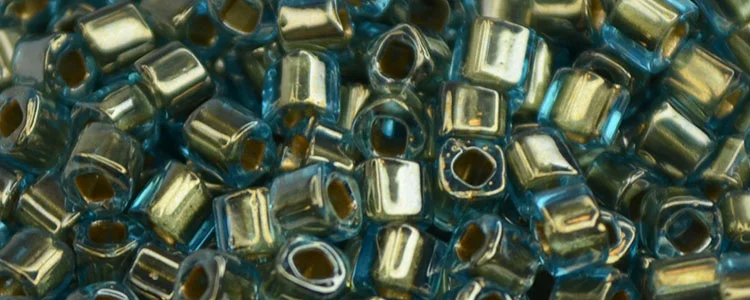 (image for) TOHO 1.5mm Cube Shape Seed Beads-Bronze Lined Aqua Transparent