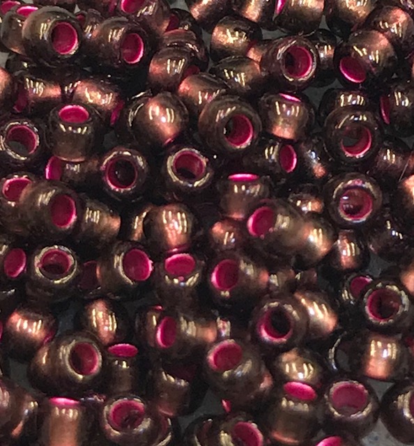 TOHO 11/o Round-Raspberry Lined Olivine (new shipment color)